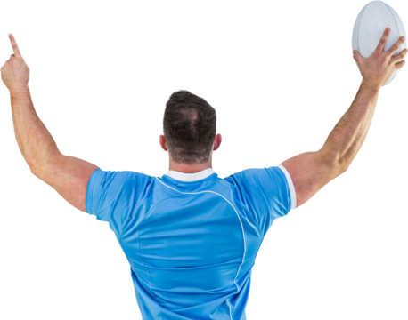 Rugby player cheering with the ball