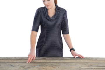 Businesswoman touching wooden table 