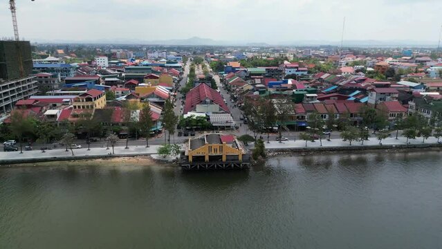 Drone footage in the middle of kampot river showing the famous Fish Market recently renovated in the old french quarter, Cambodia