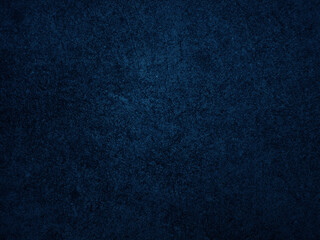 Dark rough cement wall background for graphic design or wallpaper.