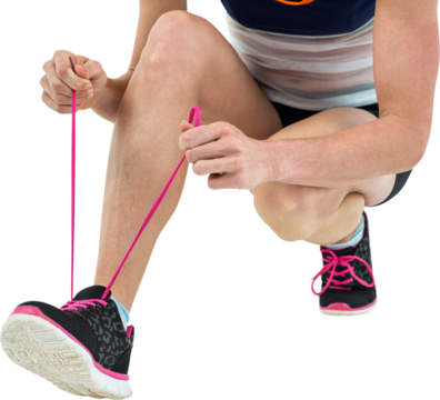Athlete tying her shoe lace - Powered by Adobe