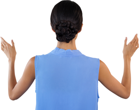 Rear view of businesswoman gesturing while using invisible interface