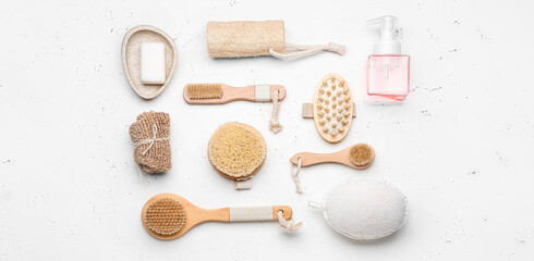 Natural bathing supplies on light background