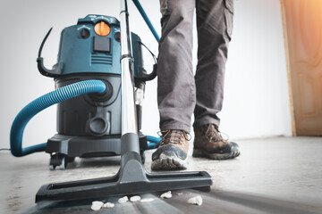 Close up on construction vacuum cleaner, construction cleaning service.