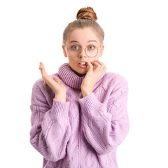 Young woman in sweater biting nails on white background