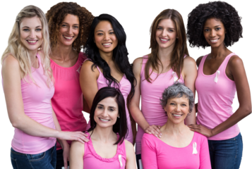 Smiling women in pink outfits posing for breast cancer awareness