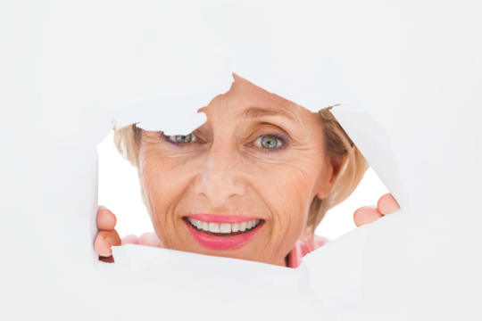 Older woman looking through rip