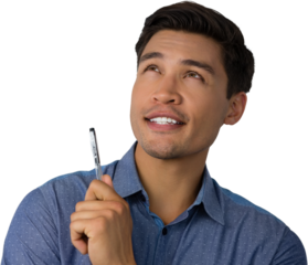 Businessman holding pen while looking away