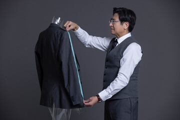 Confident Chinese fashion designer working