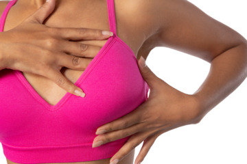Woman standing for breast cancer awareness against white background
