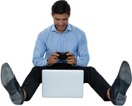 Full length of young businessman playing video game on laptop