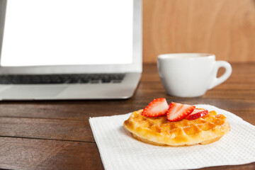 Laptop with strawberry waffle and coffee cup - Powered by Adobe