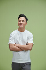 Image of young Asian man posing on background