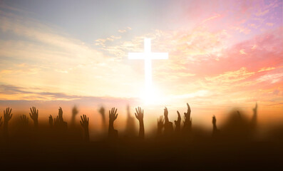 soft focus of Christian worship with raised hand on white cross background