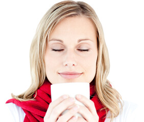 Portrait of a young woman enjoying her hot coffee in the winter 