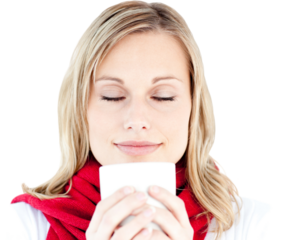 Portrait of a young woman enjoying her hot coffee in the winter
