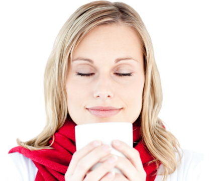 Portrait of a young woman enjoying her hot coffee in the winter 