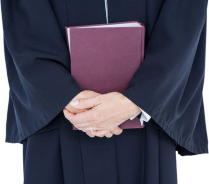  Happy lawyer looking at camera and holding law code