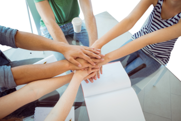 Fashion students putting hands together