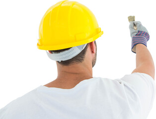 Man wearing hard hat while using paintbrush