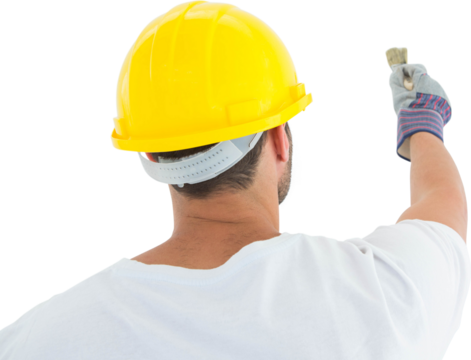 Man wearing hard hat while using paintbrush - Powered by Adobe