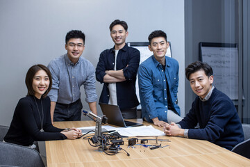 Confident Chinese designers having a meeting