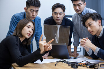 Confident Chinese designers having a meeting