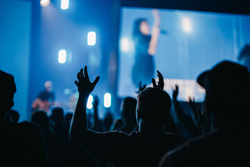 crowd of people worshiping 