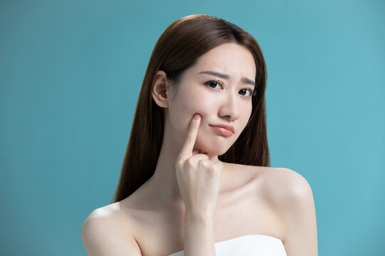 Studio shot of beautiful young Chinese woman
