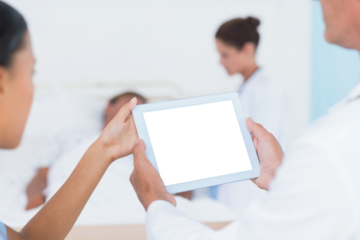 Doctors using digital tablet