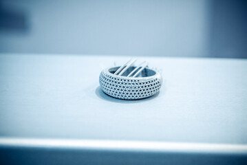 Object printed from metal powder on metal 3d printer.Object printed in laser sintering machine. Modern 3D printer printing from metal powder. Progressive additive DMLS, SLM, SLS 3d printing technology