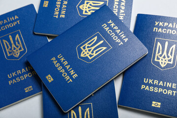 Ukrainian passports on light background, closeup