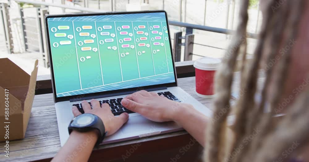 Poster biracial businessman using laptop with message notifications on screen in office
