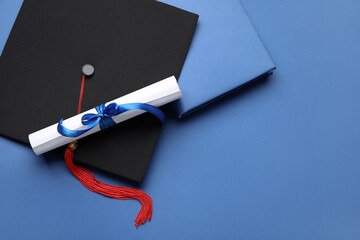 Diploma with ribbon and graduation hat on blue background