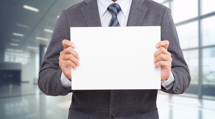 Businessman hand holding We are hiring white board.