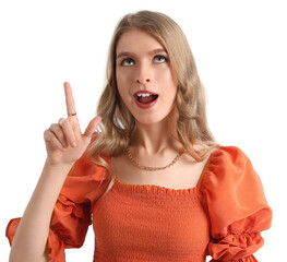 Surprised young woman pointing at something on white background