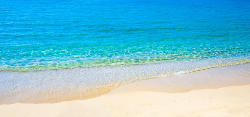 Fototapeta na wymiar Blue sea surface with waves texture on beach background
