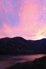 sunrise over the river, a very beautiful sunset on the Mana River in Siberia, the sky of an unusual color