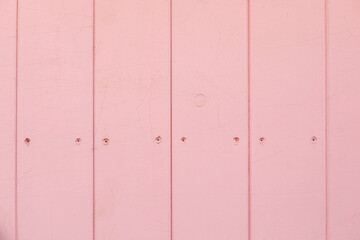 Pink pastel colored wooden planks background