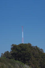 Obraz premium Airport communication antenna tower on a coastal cliff in California