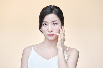 Fototapeta premium Photo of girl with flawless skin on Yellow background. Skin care and beauty concept