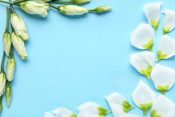 Composition with beautiful eustoma flowers and petals on color background