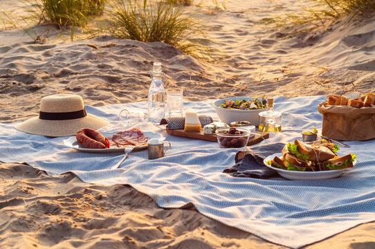 Picnic table setting at the beach at sunset