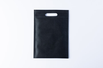 High angle view of black bag with copy space on white background