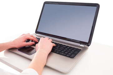 Fototapeta na wymiar Hands typing on laptop