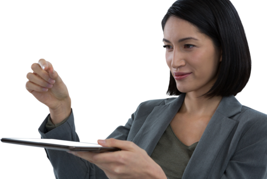 Businesswoman pretending to hold invisible object while using digital tablet