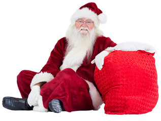 Santa sits next to his bag
