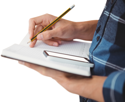 Cropped image of businessman writing with pencil on book