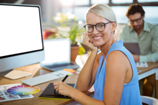 Designer using graphic tablet at office - Powered by Adobe