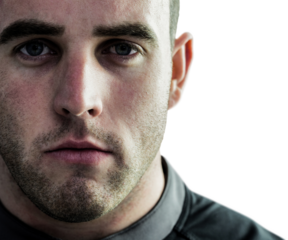 Tough rugby player looking at camera